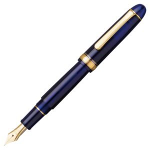A close-up of a blue platinum 3776 century fountain pen with gold accents