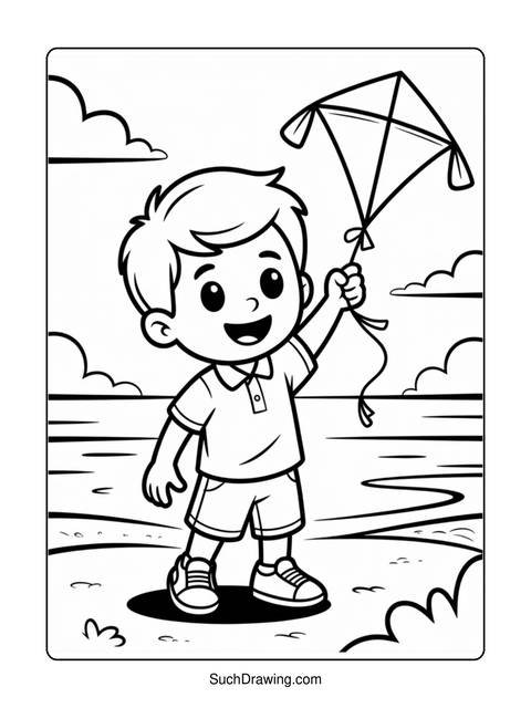 A young boy holding a kite in a field, ready to fly it